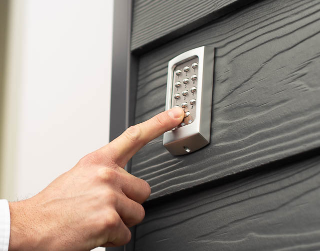 Keypad Mounted Onto Cladding with User Entering Code